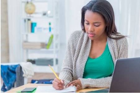 Young Woman working on Homework