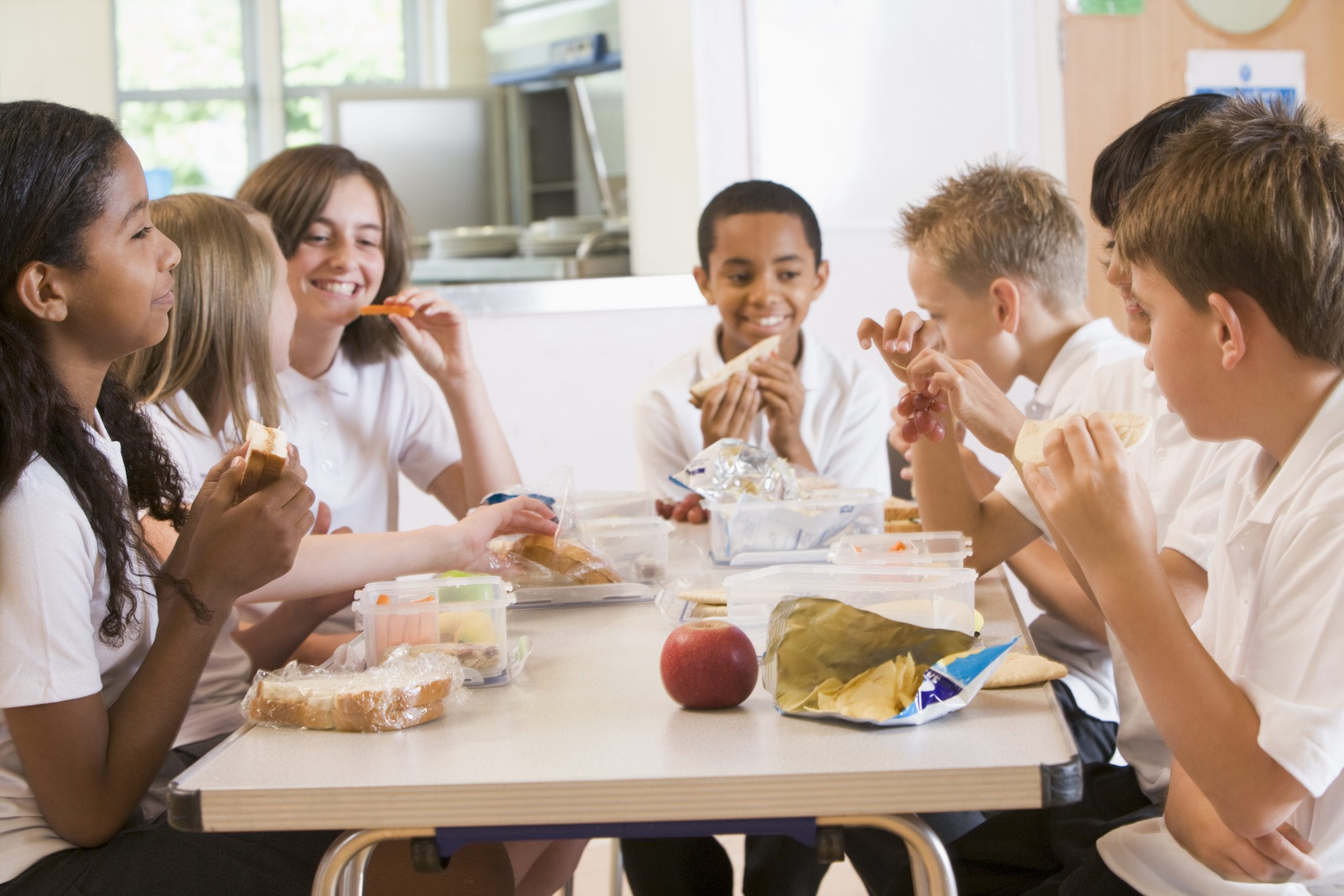 Schoolchildren enjoying lunch