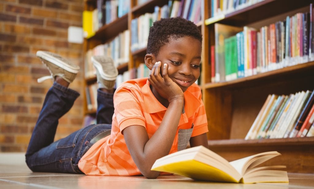 A A little boy reading a book