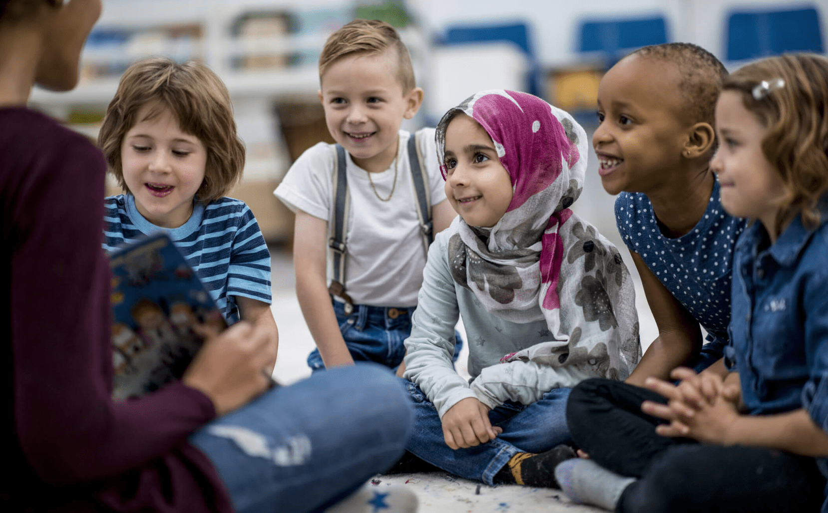 Multi-ethnic children sitting in classroom